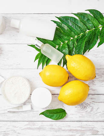 Natural organic homemade cosmetics with lemon. Skin care. Spa salon and treatments. Beautician background. Clay, lemon, beauty products, tropical summer concept. Flat lay, copy space.の写真素材