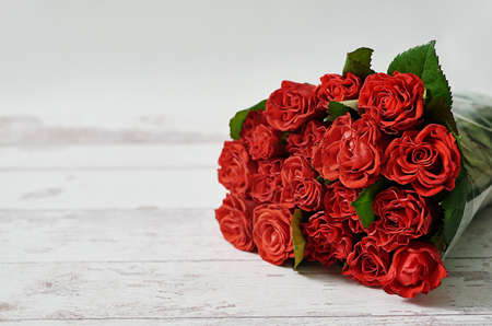 Natural red roses background in flower shop. Valentine's Day.14th of February greeting card. Mother's day floral card. Women's Day. Flowers gift. Flower delivery. Wedding invitation. Happy birthdayの写真素材