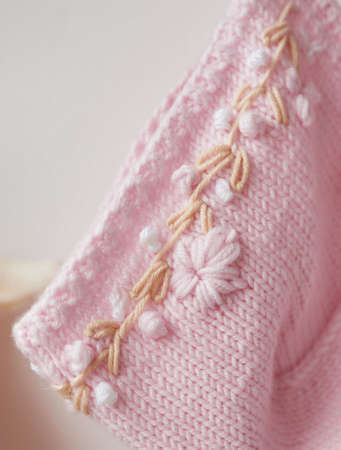 Knitted kids clothes and accessories for knitting. Needlework and knitting. Hobbies and creativity....
