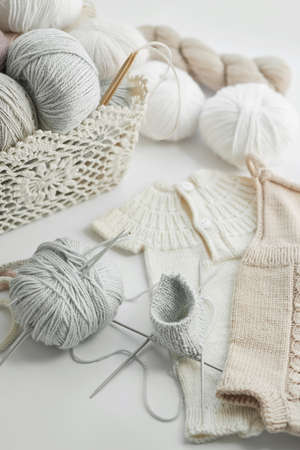 Knitted kids clothes and accessories for knitting. Needlework and knitting. Hobbies and creativity....