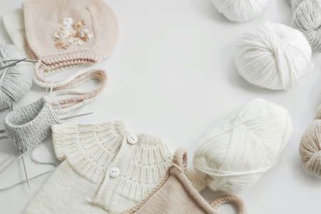 Knitted kids clothes and accessories for knitting. Needlework and knitting. Hobbies and creativity. Knit for kids. handmade. Hobbies and creativityの写真素材
