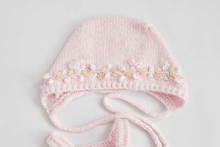 Knitted hat, kids clothes and accessories for knitting. Needlework and knitting. Hobbies and...