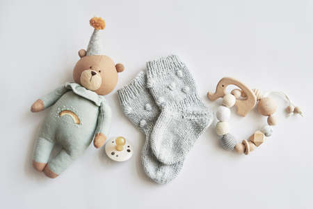 Baby accessories, boots, socks, wooden teether, pacifier, toy. gift for childの写真素材