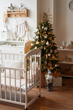 Winter holidays and vacations. Christmas and New Year decor background. Christmas tree and toys. Nursery Christmas decoration. Children's room interior.の写真素材