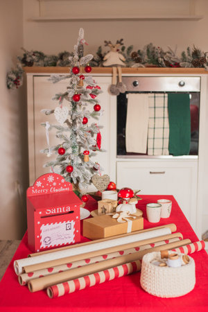 Christmas tree and gifts on the red table. Christmas and New Year conceptの写真素材