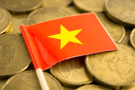 Vietnam flag on gold coins, finance and banking business.の写真素材