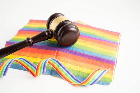 Gavel for judge lawyer on rainbow flag, symbol of LGBT pride month.の写真素材