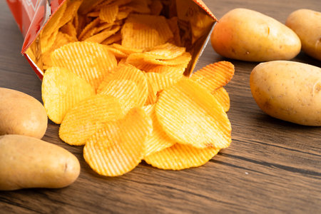 Potato chips , delicious BBQ seasoning spicy for crips, thin slice deep fried snack fast food.の写真素材
