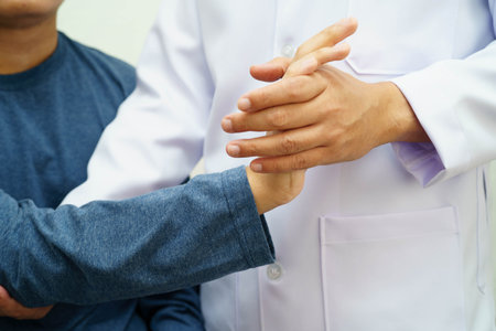 Physical therapy, Asian therapist doctor treat perform pain therapy in hospital.の写真素材