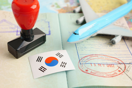 Korea passport with approved stamp on document for tourism to immigration at airport in country.の写真素材