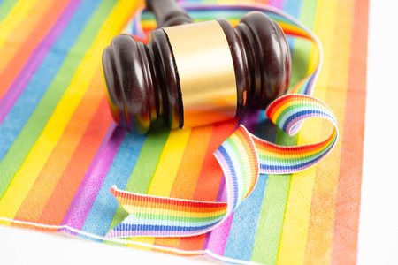 Gavel for judge lawyer on rainbow flag, symbol of LGBT pride month.の写真素材