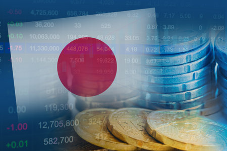 Japan flag on stock investment trading with coin and graph.の写真素材
