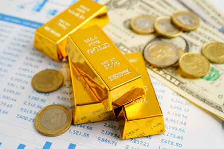 Gold bars with US dollar and Euro banknote money, finance trading investment business currency...