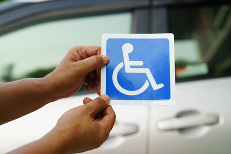 Wheelchair sticker sign on car for safety travel.の写真素材