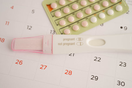 Pregnancy test with birth control pills for female of ovulation day, fetus, maternity, childbirth.の写真素材