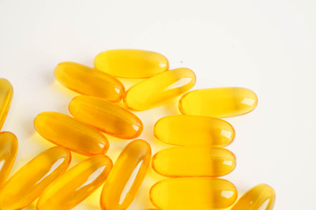 Fish oil or Cod liver oil gel in capsules with omega 3 vitamins, supplementary healthy food.