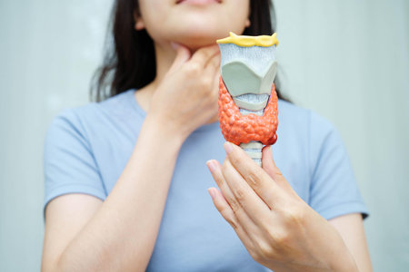 Hyperthyroidism, Overactive Thyroid, Thyroid Lymphoma, Asian woman with thyroid gland human anatomy...