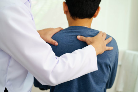 Physical therapy, Asian therapist doctor treat perform pain therapy in hospital.の写真素材