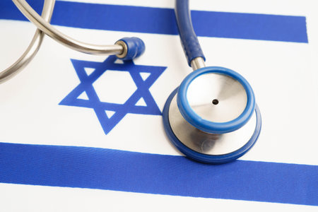 Israel flag with black stethoscope, Business and finance concept.の写真素材