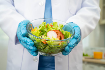 Nutritionist holding healthy food for patient in hospital, nutrition and vitamin.