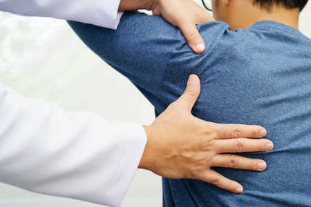 Physical therapy, Asian therapist doctor treat perform pain therapy in hospital.の写真素材