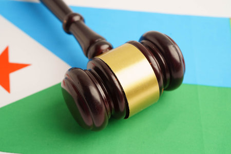 Djibouti law, Legal, justice and agreement, wooden court gavel on flag.の写真素材