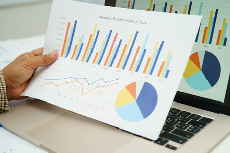 Asian business woman working with financial graph.の写真素材