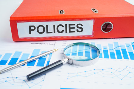Policies. binder with graph in business office.の写真素材