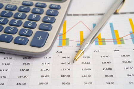Calculator on chart graph paper. Finance, account, statistic, investment data economy, stock...