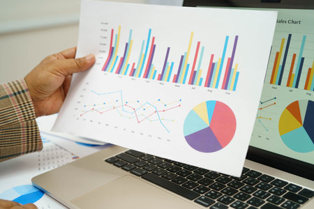 Asian business woman working with financial graph.の写真素材