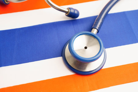 Thailand flag with black stethoscope.の写真素材