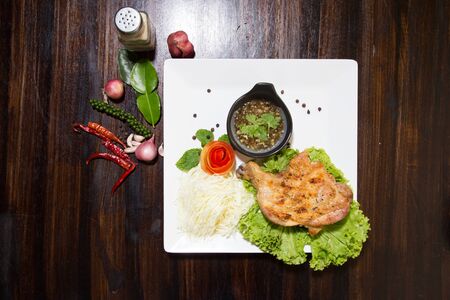 grilled chicken with Thai style dipping spicy sauce for roasted or grilled food (fish sauce and chilli)の写真素材