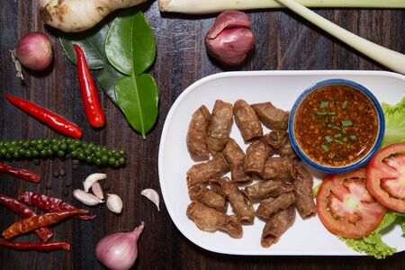 Deep fried pork small intestine or Chitterlings internal organs of pig serve with spicy sauceの写真素材