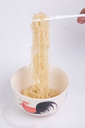 Bowl of boiled egg noodles isolated on white background.の写真素材