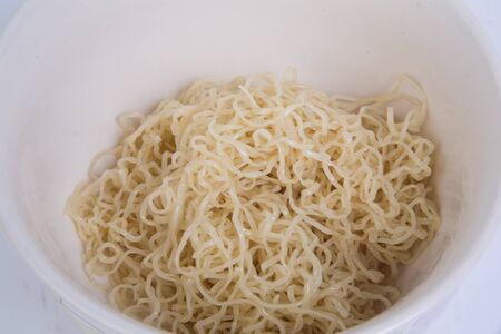 Bowl of boiled egg noodles isolated on white background.の写真素材