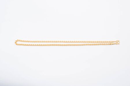 Gold chain necklace isolated on white background.の写真素材