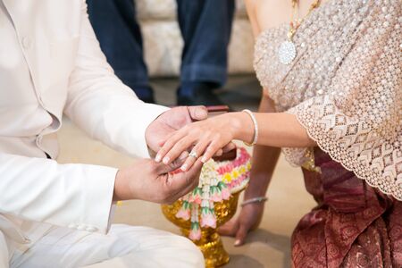Wedding ring,groom and bride hand in wedding ceremony (1)の写真素材