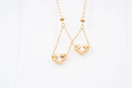 Gold chain necklace isolated on white background.