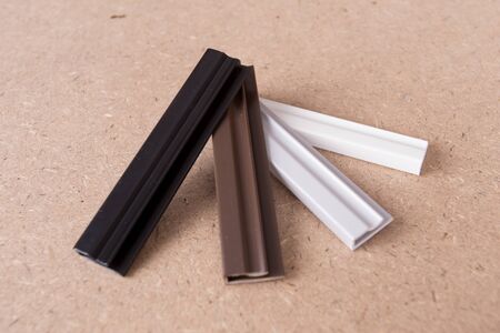 Pvc Plastic Window parts isolated on brown background