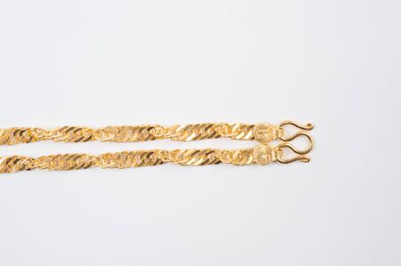Gold chain necklace isolated on white background.の写真素材