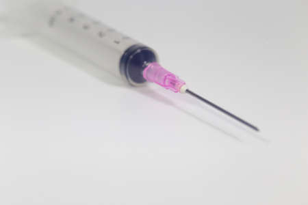 Empty syringe closeup isolated on white background.の写真素材