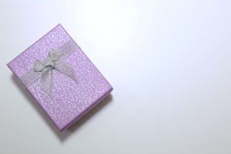 purple opened gift box isolated on whiteの写真素材