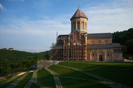 View of church in Bodbe monastery and mountains in Georgia