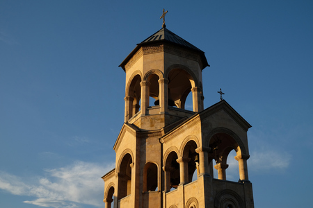 View of Holy Trinity Cathedral of Tbilisi against blue skyの写真素材
