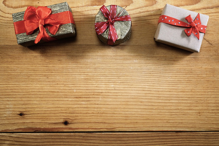 Three gift boxes with copy space on woodの写真素材