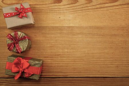 Three gift boxes with copy space on woodの写真素材