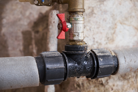 Closeup of old plumbing with tapの写真素材