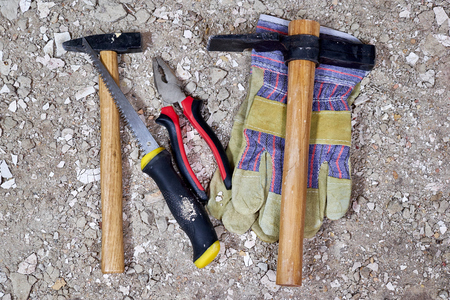 Construction tools on old dust, plaster and stoneの写真素材