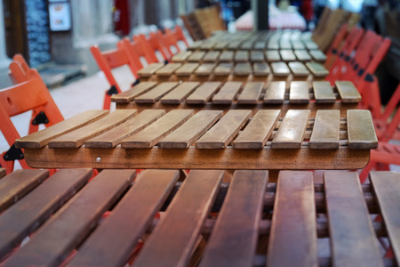 Row of empty cafe tables and chairsの写真素材