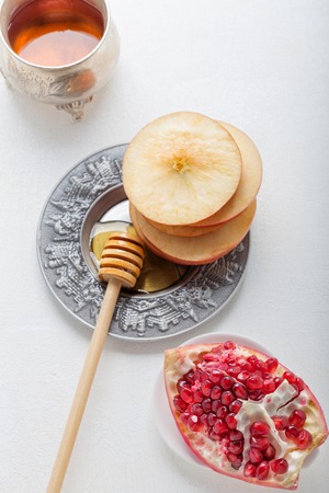 Apples, pomegranate and honey for Rosh Hashanah holidayの写真素材